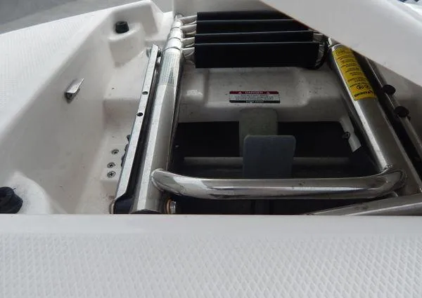 Slide: The Image of 2015 Chaparral 284 Sunesta boat ladder and storage compartment. - 24