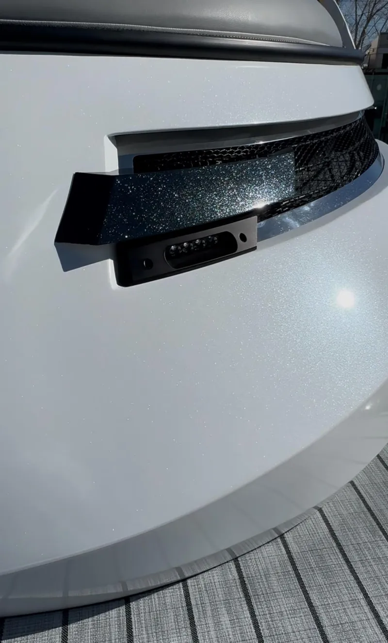 Slide: The Image of 2025 Montara 25' SURF BOSS 2.0 CWDH, sleek white exterior detail. - 12