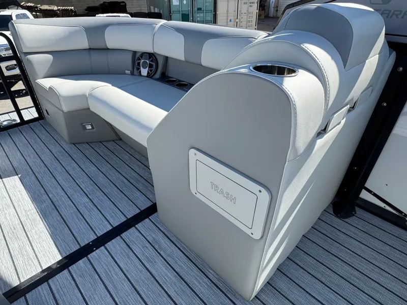 Slide: The Image of 2025 Montara 25' SURF BOSS 2.0 CWDH boat interior with gray seating and striped flooring. - 16