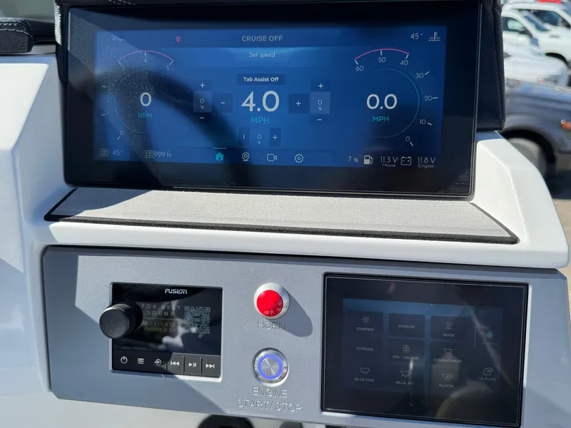 Slide: The Image of Dashboard of 2025 Montara 25' SURF BOSS 2.0 CWDH with digital displays and controls. - 24