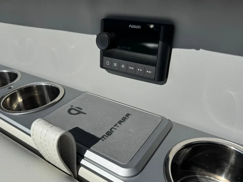 Slide: The Image of Interior of 2025 Montara 25' SURF BOSS 2.0 CWDH with audio controls and cup holders. - 27