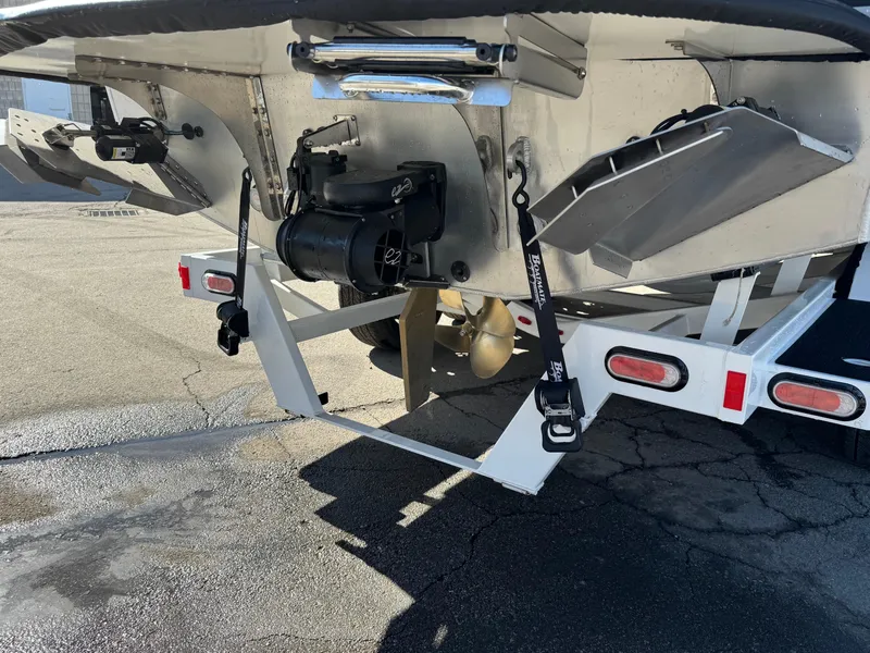 Slide: The Image of 2025 Montara 25' SURF BOSS 2.0 CWDH boat stern with propeller and trim tabs. - 6