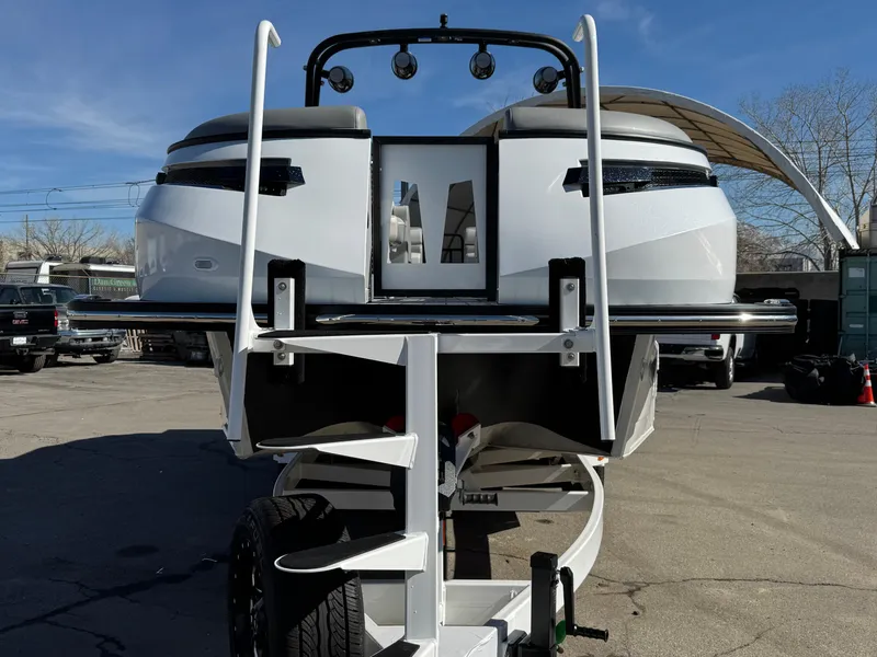 Slide: The Image of 2025 Montara 25' SURF BOSS 2.0 CWDH boat on trailer, rear view. - 9