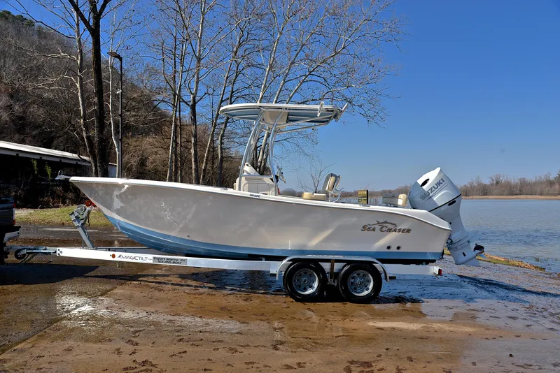 Slide: The Image of 2022 Sea Chaser 22 HFC boat on trailer by a lake. - 11
