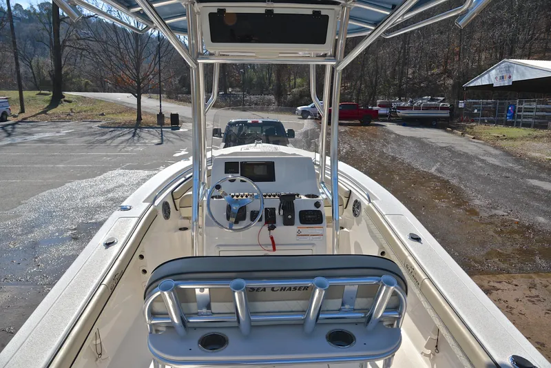 Slide: The Image of 2022 Sea Chaser 22 HFC boat interior with steering console and seating. - 18