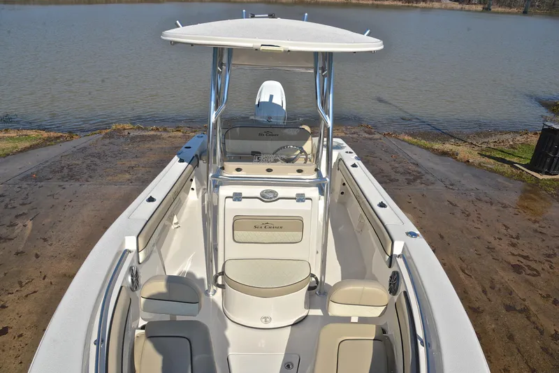 Slide: The Image of 2022 Sea Chaser 22 HFC boat at a lakeside launch ramp. - 24