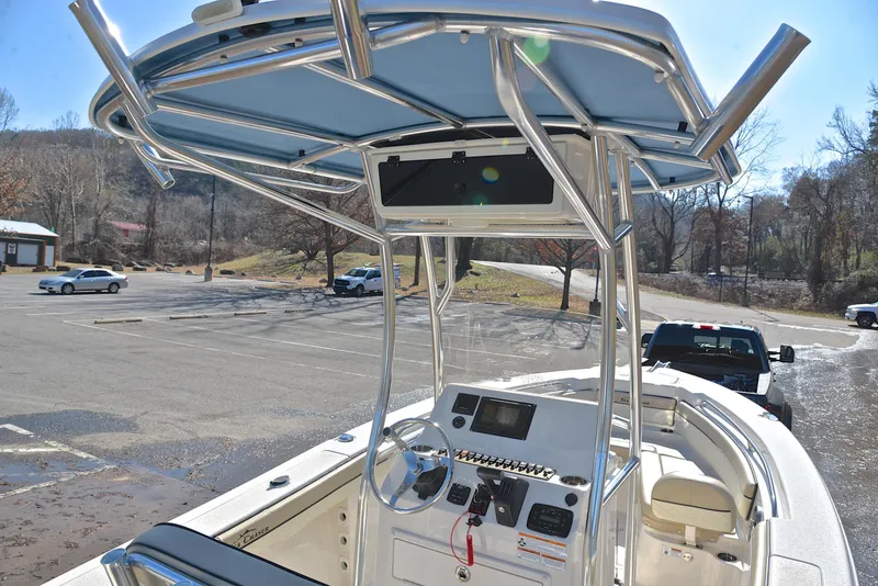Slide: The Image of 2022 Sea Chaser 22 HFC boat with T-top and console in parking lot. - 27