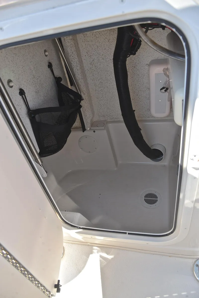 Slide: The Image of 2022 Sea Chaser 22 HFC storage compartment with drainage and utility features. - 29