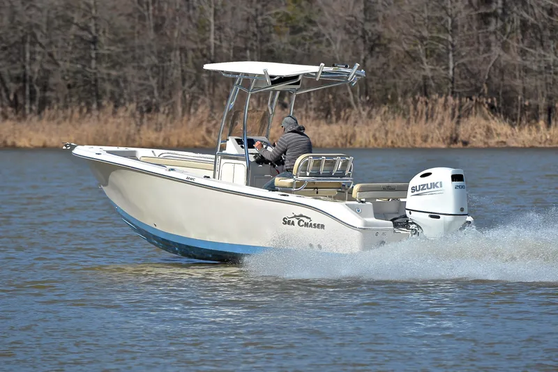 Slide: The Image of 2022 Sea Chaser 22 HFC boat cruising on a lake with Suzuki outboard motor. - 4