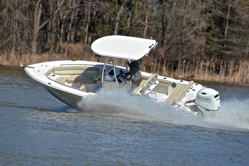 Slide: The Image of 2022 Sea Chaser 22 HFC boat cruising on a lake with Suzuki outboard motor. - 5