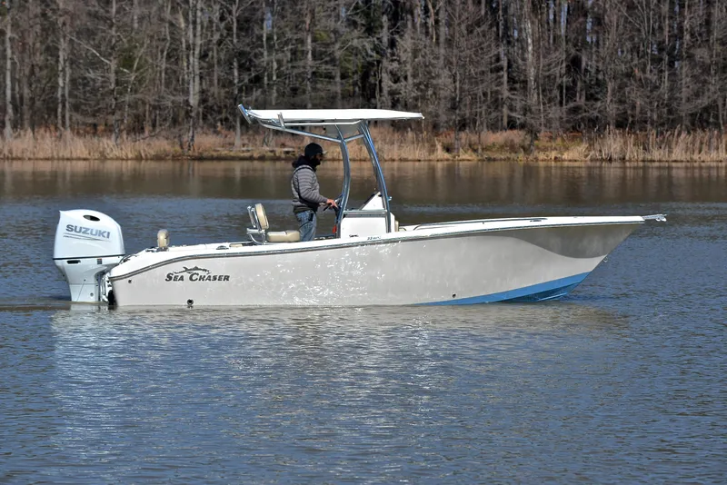 Slide: The Image of 2022 Sea Chaser 22 HFC boat on calm lake with Suzuki outboard motor. - 6