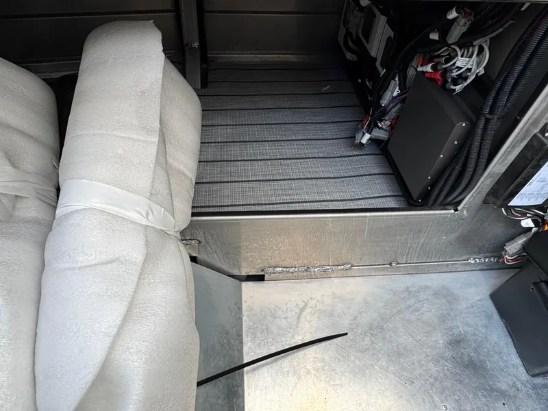 Slide: The Image of Interior view of 2025 Montara 25' SURF BOSS 2.0 SL boat, showing seating and wiring. - 32