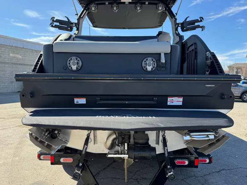 Slide: The Image of 2025 Montara 25' SURF BOSS 2.0 SL boat, rear view with speakers and swim platform. - 4