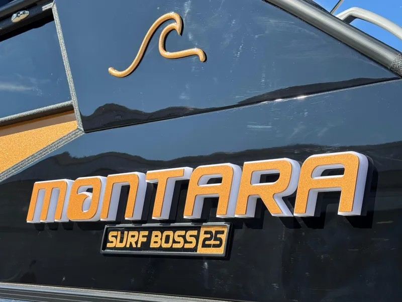 Slide: The Image of 2025 Montara 25' SURF BOSS 2.0 SL boat logo on sleek black surface. - 7