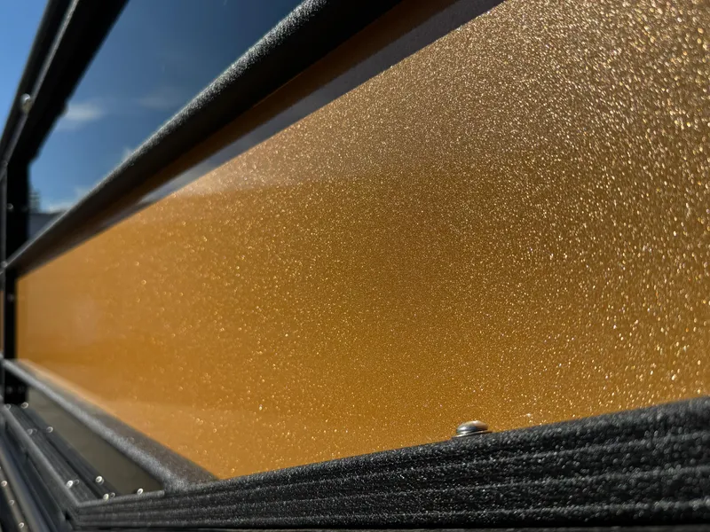 Slide: The Image of Close-up of 2025 Montara 25' SURF BOSS 2.0 SL with metallic gold finish. - 8