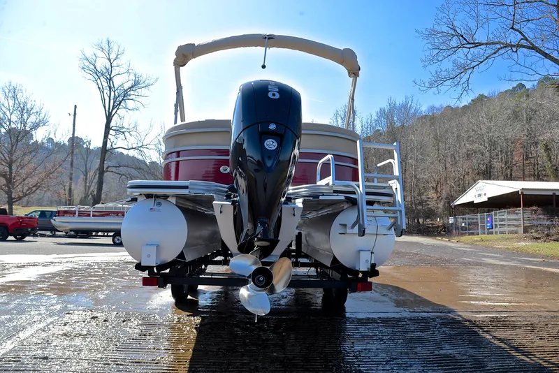 Slide: The Image of 2021 Lowe SS250 pontoon boat with outboard motor on a sunny day. - 13