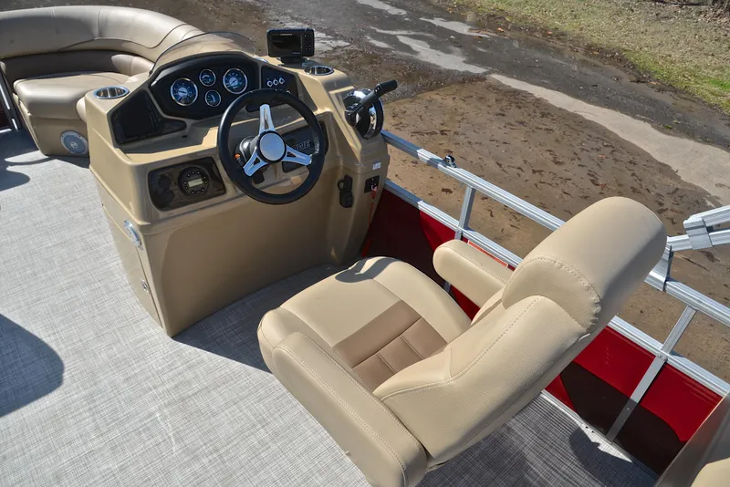 Slide: The Image of 2021 Lowe SS250 boat interior with beige seating and steering console. - 26