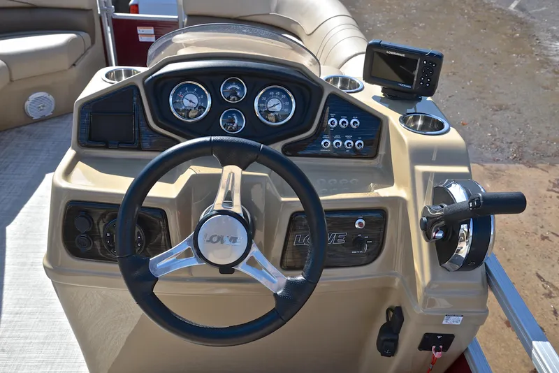 Slide: The Image of 2021 Lowe SS250 boat dashboard with steering wheel and gauges. - 27