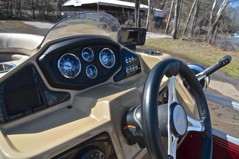 Slide: The Image of Dashboard of 2021 Lowe SS250 boat with steering wheel and gauges. - 28