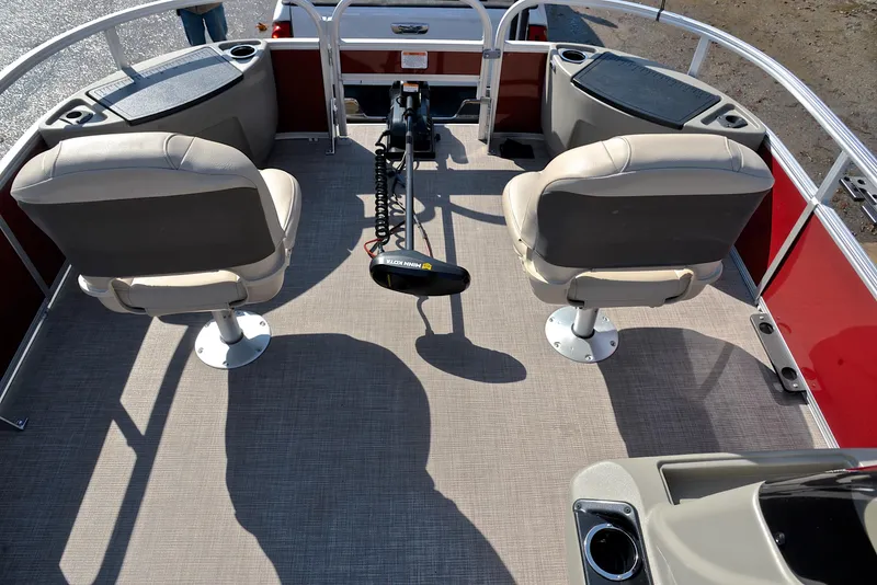 Slide: The Image of 2024 Sun Tracker BASS BUGGY 18 interior with two swivel seats and fishing rod holder. - 22