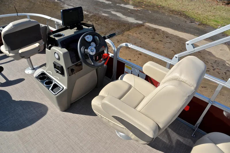 Slide: The Image of 2024 Sun Tracker BASS BUGGY 18 interior with steering console and comfortable seating. - 25