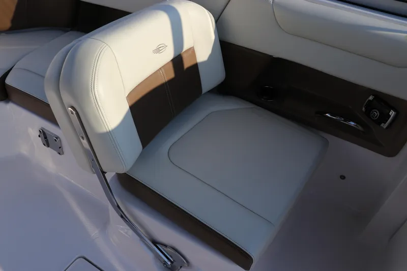 Slide: The Image of 2018 Chaparral 230 Suncoast boat seat with brown and beige upholstery. - 11