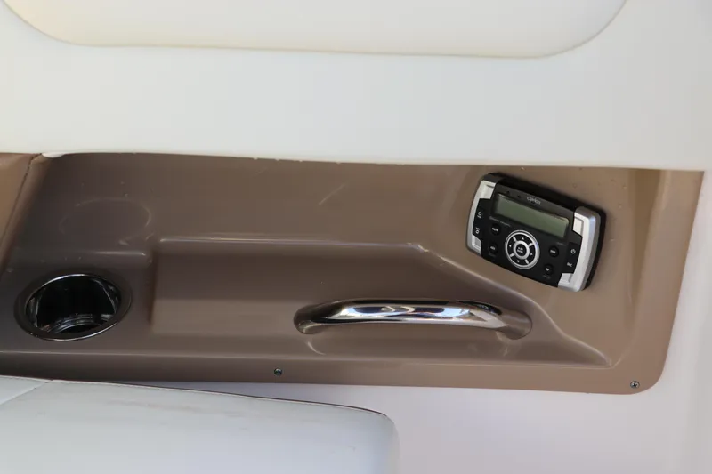 Slide: The Image of Interior detail of 2018 Chaparral 230 Suncoast boat with control panel and cup holder. - 14