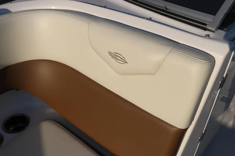 Slide: The Image of 2018 Chaparral 230 Suncoast boat interior with brown and cream upholstery. - 23