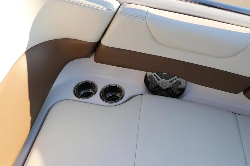 Slide: The Image of 2018 Chaparral 230 Suncoast boat interior with cup holders and speaker. - 36