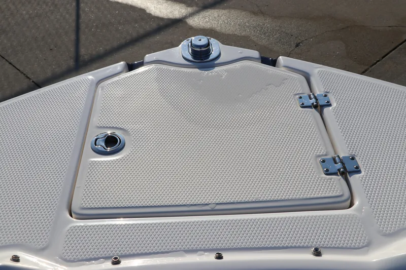 Slide: The Image of 2018 Chaparral 230 Suncoast boat deck with textured surface and hatch. - 38