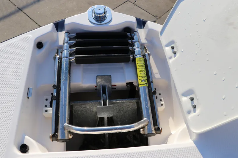 Slide: The Image of 2018 Chaparral 230 Suncoast boat ladder and anchor compartment. - 39