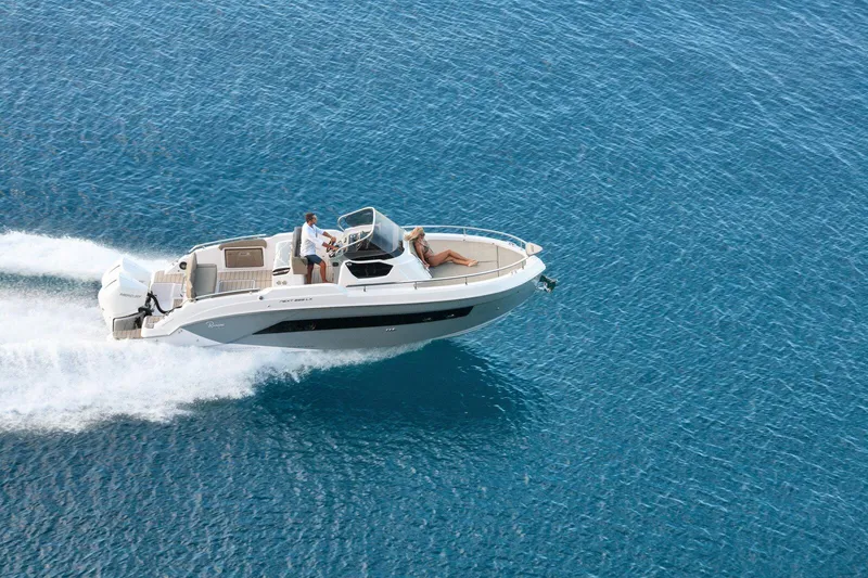 Slide: The Image of 2025 Ranieri NEXT 285 XL boat cruising on clear blue water. - 2
