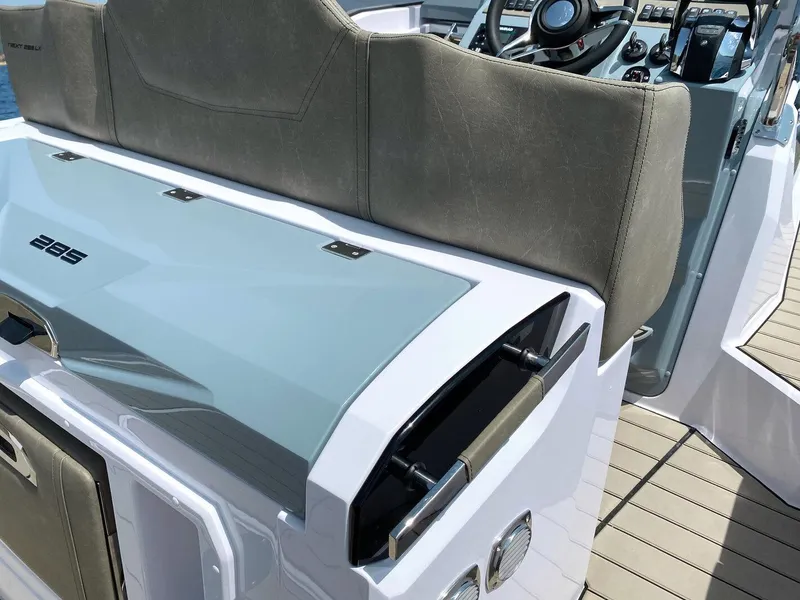 Slide: The Image of 2025 Ranieri NEXT 285 XL boat interior with sleek seating and modern dashboard design. - 24