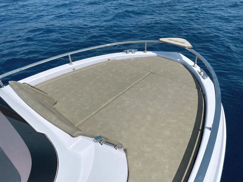 Slide: The Image of 2025 Ranieri NEXT 285 XL boat deck on calm blue sea. - 35