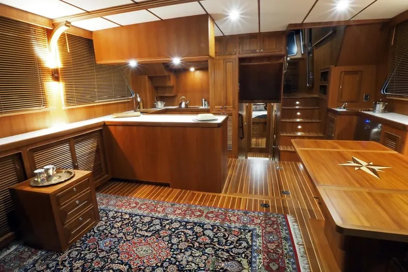 Slide: The Image of Luxurious interior of 2025 Helmsman Trawlers 46 Pilothouse with wood finishes and elegant decor. - 13