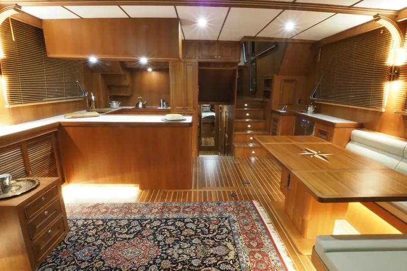 Slide: The Image of Luxurious interior of 2025 Helmsman Trawlers 46 Pilothouse with wood finishes and elegant decor. - 14