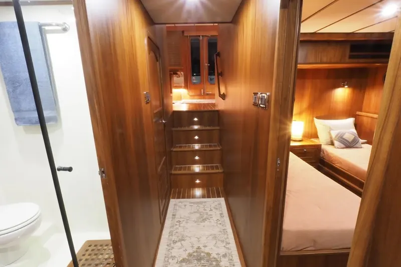 Slide: The Image of Luxurious interior of 2025 Helmsman Trawlers 46 Pilothouse with wood finish and cozy lighting. - 29