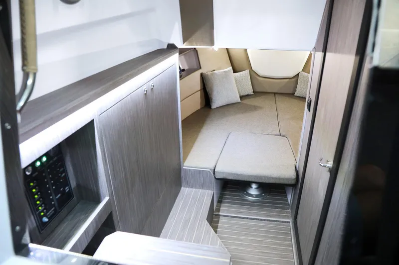 Slide: The Image of Interior of 2025 Ranieri NEXT 330 XL boat, featuring modern cabin design and comfortable seating. - 10