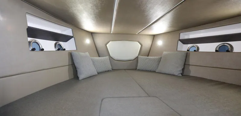 Slide: The Image of Interior cabin of 2025 Ranieri NEXT 330 XL boat with cushions and portholes. - 12