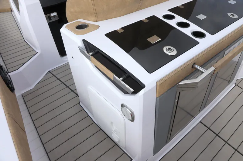 Slide: The Image of 2025 Ranieri NEXT 330 XL boat interior with modern kitchen amenities. - 9