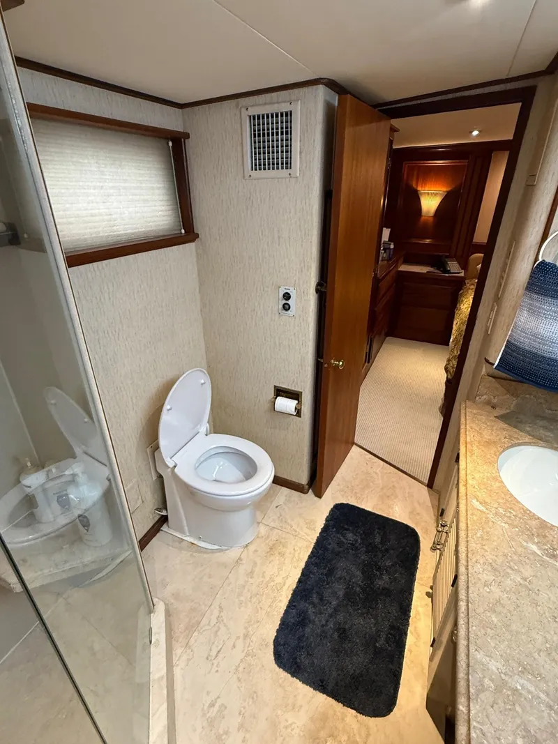 Slide: The Image of Bathroom interior of a 1972 Burger 81 Raised Pilothouse yacht, featuring modern amenities. - 15