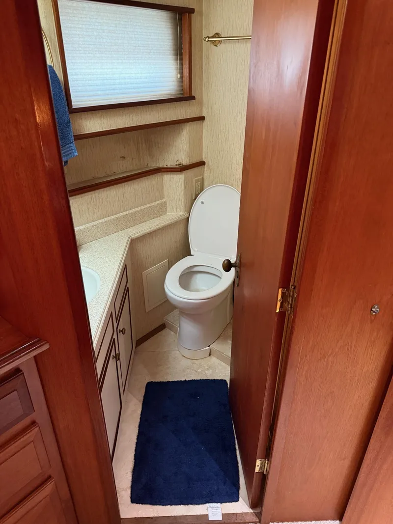 Slide: The Image of Bathroom interior of 1972 Burger 81 Raised Pilothouse yacht, featuring toilet and sink. - 19