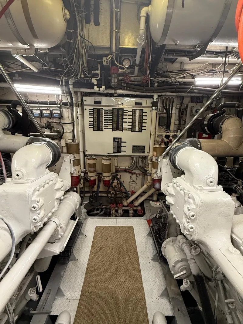 Slide: The Image of Engine room of 1972 Burger 81 Raised Pilothouse yacht, featuring machinery and control panel. - 20