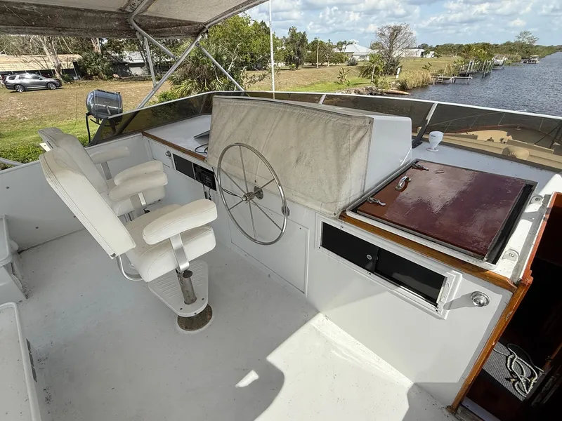 Slide: The Image of Pilothouse of 1972 Burger 81 Raised yacht with steering wheel and seating. - 3