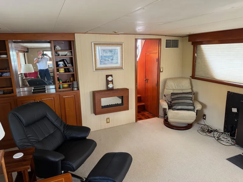 Slide: The Image of Interior of 1972 Burger 81 Raised Pilothouse yacht with comfortable seating and decor. - 6