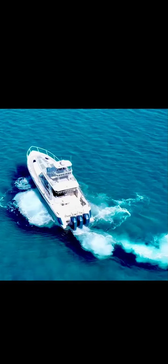 Slide: The Image of Intrepid 477 Evolution 2022 cruising on clear blue waters, aerial view. - 17