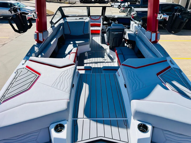 Slide: The Image of 2025 Nautique Super Air Nautique G23 interior with sleek seating and modern design. - 11