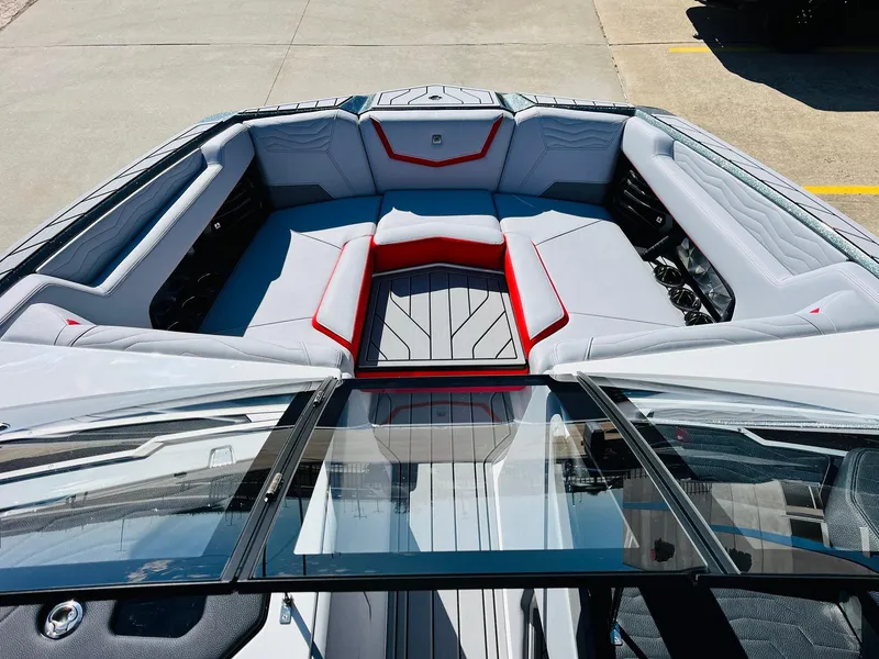 Slide: The Image of 2025 Nautique Super Air Nautique G23 boat interior with sleek seating and modern design. - 13