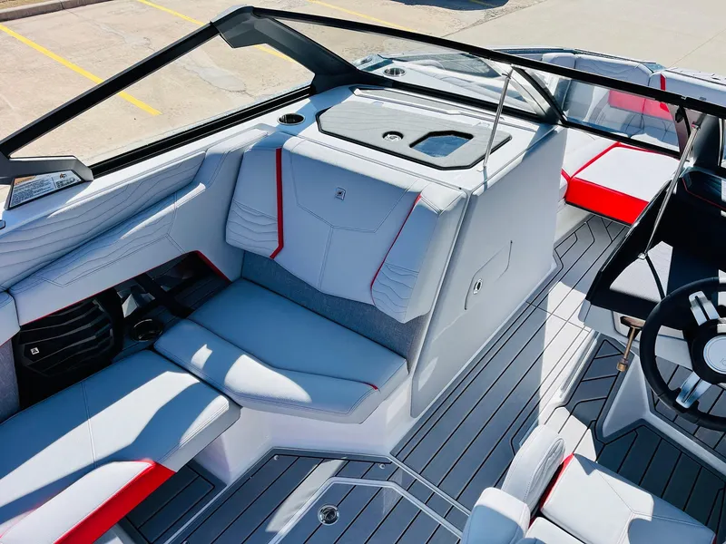 Slide: The Image of 2025 Nautique Super Air Nautique G23 interior with modern seating and sleek design. - 21