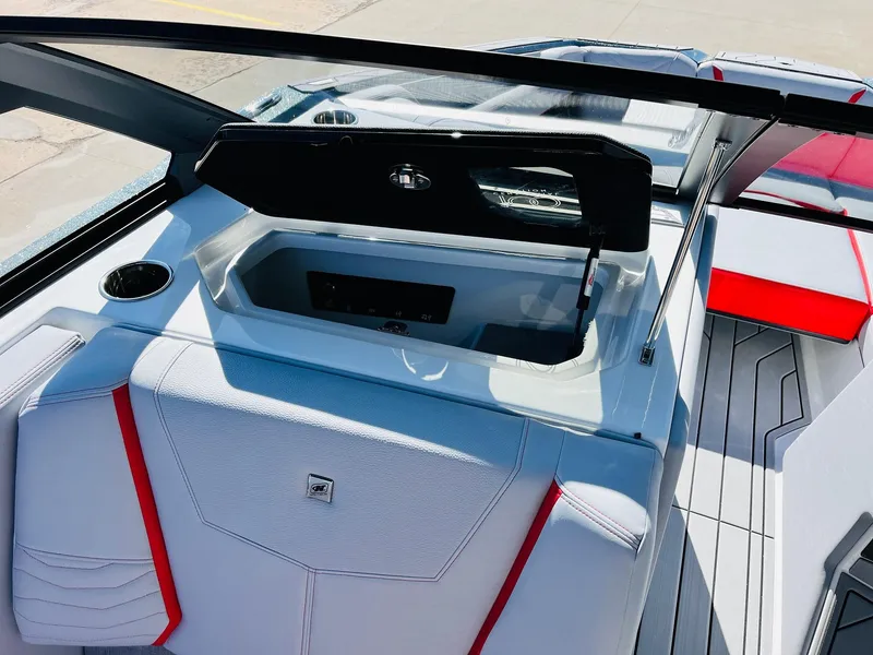 Slide: The Image of 2025 Nautique Super Air Nautique G23 interior with sleek design and red accents. - 22